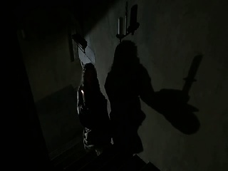 Kellie Blaise kneeling on a bed as a guy has sex with her