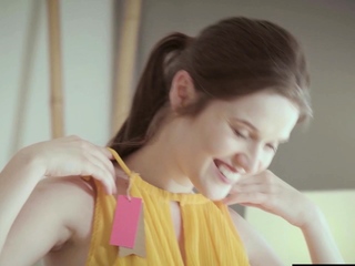 Playful babe painting her perfect boobs